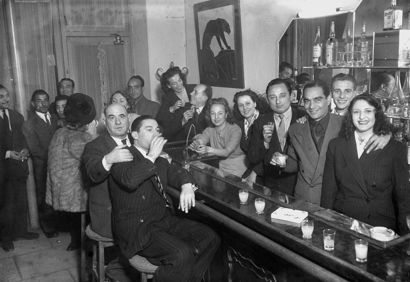 Al Capone with a gang at a bar, 1945.