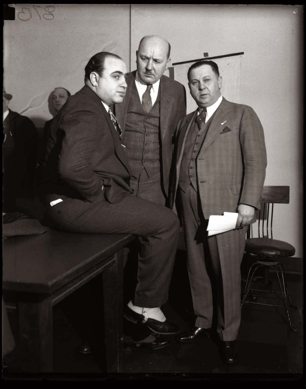 Al Capone, Asst. State Attorney Frank Mast, and Bailiff Joe Weinberg in a Chicago Federal Building courtroom, April 4, 1931.