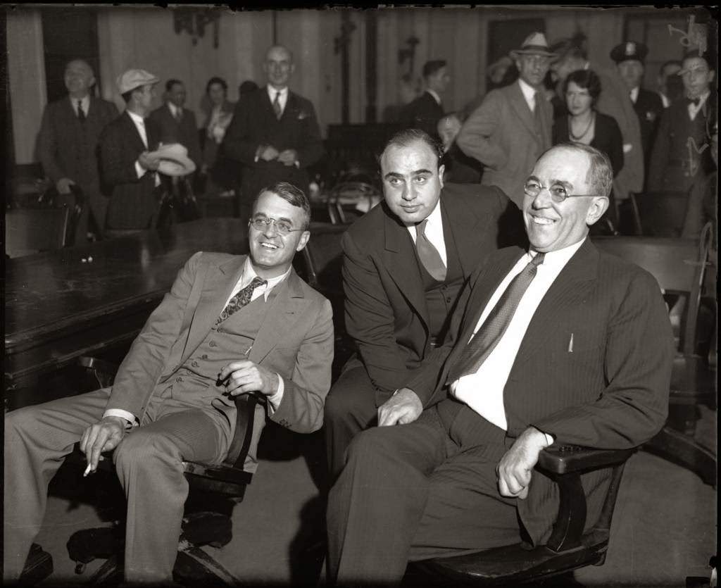 Al Capone in federal court in Chicago during his 1931 tax-evasion trial, with lawyers Michael Ahern and Albert Fink.