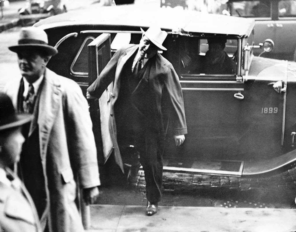 Al Capone and attorney Michael Ahern arriving at the federal building, October 13, 1931.