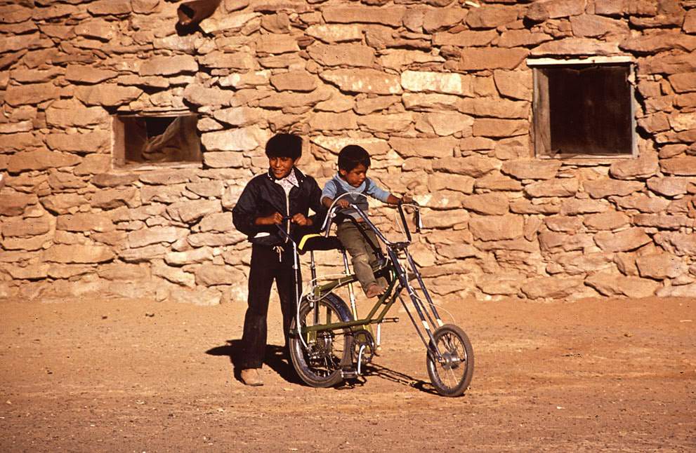 Boys play on a bicycle on the Hopi Reservation in Arizona, 1972.