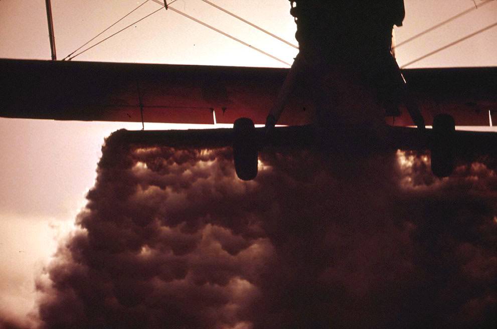 A crop duster plane flies low over a field in California's Imperial Valley, 1972.