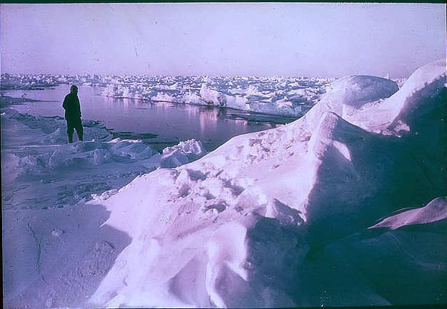 Sir Ernest Shackleton watching a lead forming, 1915.