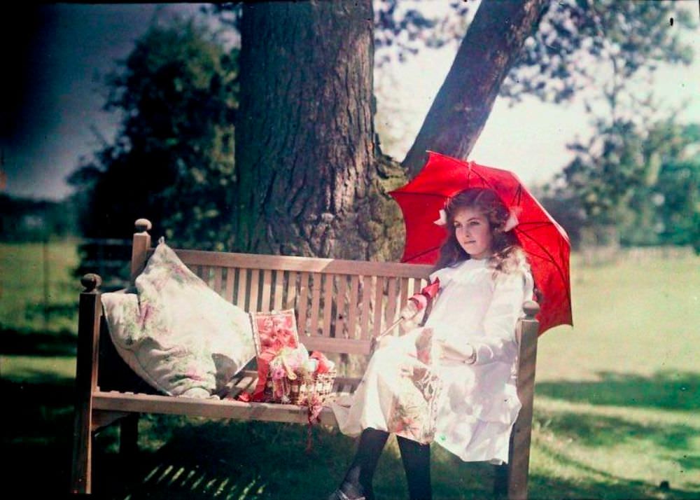 Girl with a parasol sitting on a bench, 1908