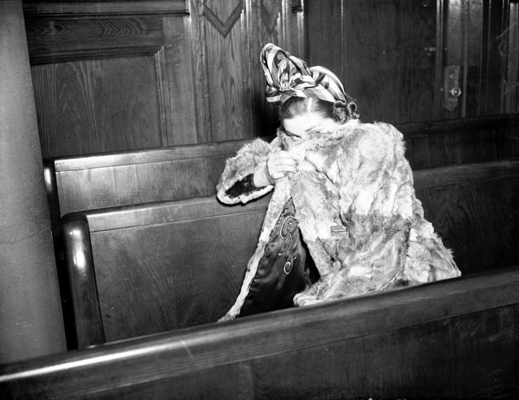 Grace Druggan, 26, the wife of notorious prohibition era beer baron Terry Druggan, is in court on March 7, 1941, to get her son Terrence Jr., 3, back from the elder Druggan. Druggan violated a custody agreement in effect since she filed for divorce that allowed Druggan to have the boy on weekends only. Druggen had refused to give him up the prior weekend, but returned him by way of a threat from the judge to hold him in contempt of court. The divorced Grace Druggan committed suicide five years later by jumping off Navy Pier in 1946.