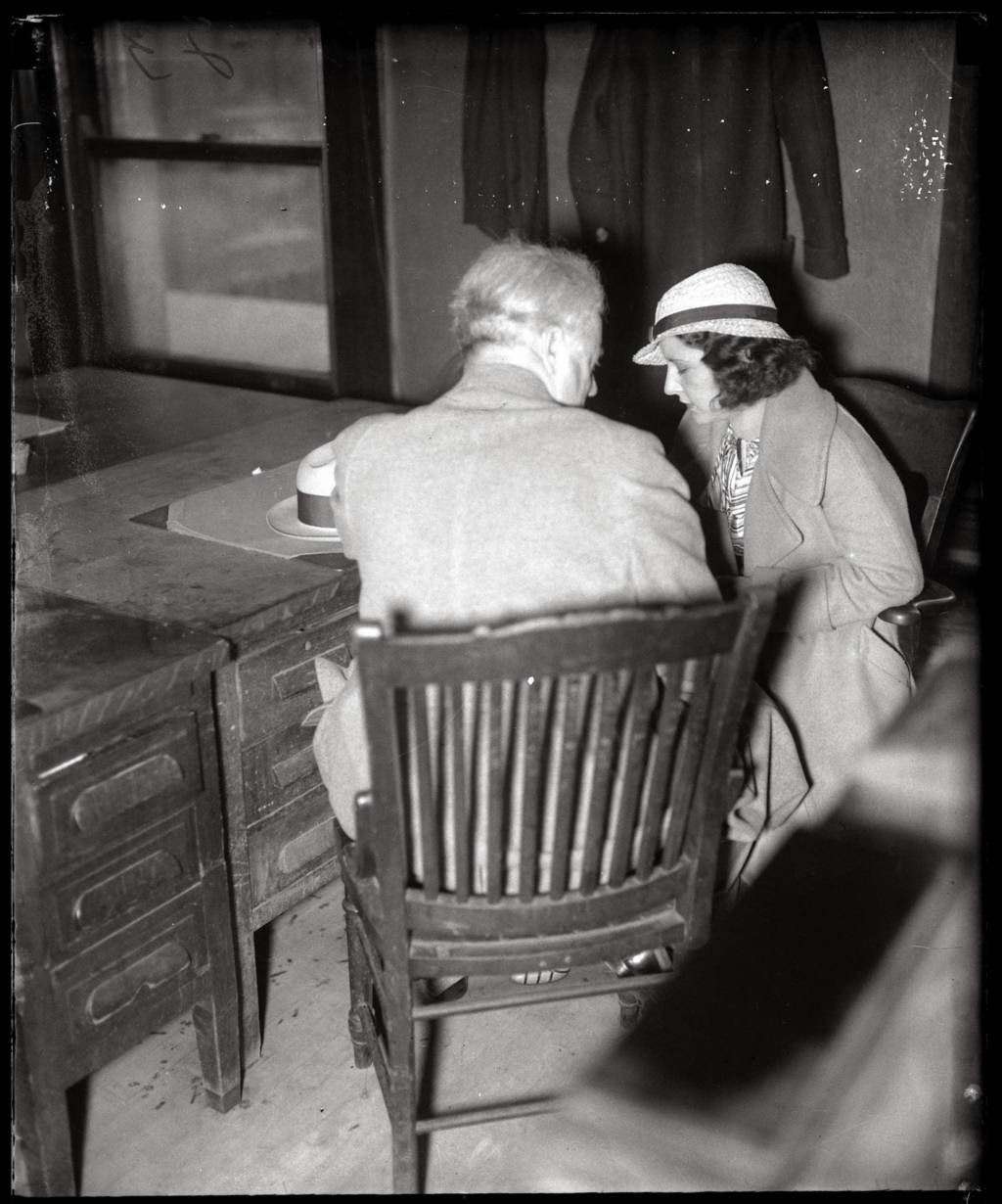 Evelyn 'Billie' Frechette, 27, right, was arrested in Chicago while her boyfriend and fugitive, John Dillinger, watched helplessly nearby on April 9, 1934. Frechette, who had met Dillinger in 1933, was charged with harboring the fugitive in her apartment. She spent two years in jail, getting out in 1936. Upon her release, Frechette toured in a theatrical production called "Crime Doesn't Pay" with members of Dillinger's family.