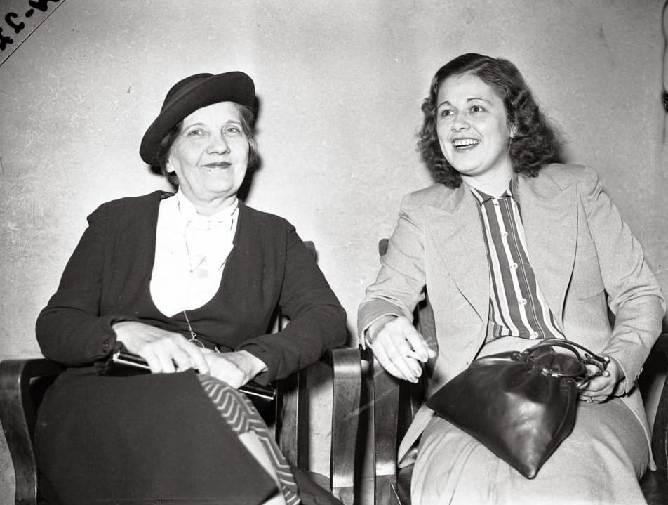 Miss Emeline Poshil, 51, left, and Miss Bernice Sheppard, 25, at the State's Attorney's Office after both were arrested for owning and operating a bookie for women on Oct. 19, 1938. According to the Chicago Tribune, Miss Sheppard was looking after the place, located at 5057 Lake Park Avenue, for her mother Mae, who was out watching a horse that she owned at the track. The Sheppard mother and daughter team, along with Poshil who was a clerk, had run the bookie for women for eight or ten years. "The ladies were nibbling jelly rolls and sipping soft drinks and coffee," according to the newspaper, when State's Attorney axmen came busting into the betting establishment for discriminating women. Detective Daniel Moriarty and his fellow axmen were ill at ease arresting the women with Moriarty later saying "I was a little embarrassed." The headline read "Axmen Toast Ladies With A Bang Up Party; Axmen Wreck Handbook Run By Women."