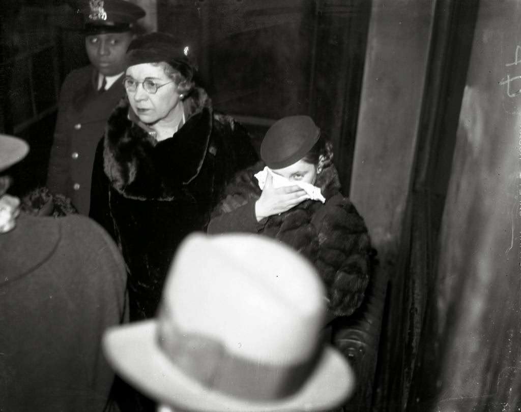 Mae Blalock, who also went by Mae Davis, was arrested in Baltimore and returned to Chicago, circa Feb. 20, 1934. Blalock was the girlfriend of Basil "The Owl" Banghart, who was an associate of gangster boss Roger Touhy. Blalock was arrested for possessing some of the money Banghart stole in a mail truck robbery. According to the Chicago Tribune, Blalock claimed to be Banghart's wife.