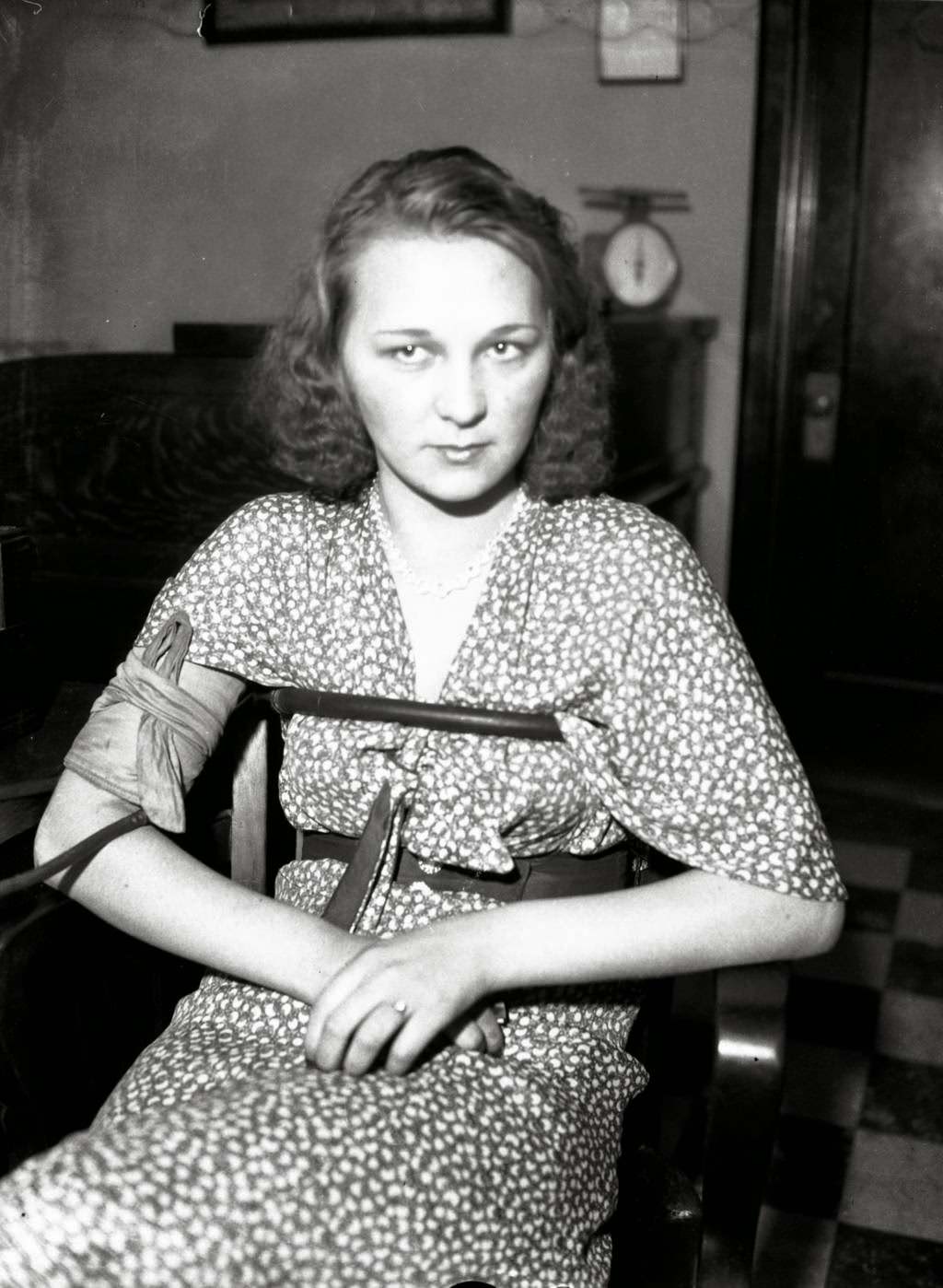 Della Broderick is the sister-in-law of inmate Jack Lawrence who somehow got a hold of a gun and shot and killed a guard, and then himself, while in the county jail on June 22, 1932. Lawrences' wife Olive was brought in for questioning along with her sister, Della Broderick, on June 24, 1932, on charges that one of the two women had smuggled the pistol to Lawrence. Olive Lawrence visited Jack on the day of the shootings and Della Broderick visited several days prior and brought with her a fruit basket for Jack. Lawrence was in jail for robbery and was about to go on trial for killing policeman John Nerad of Cicero.