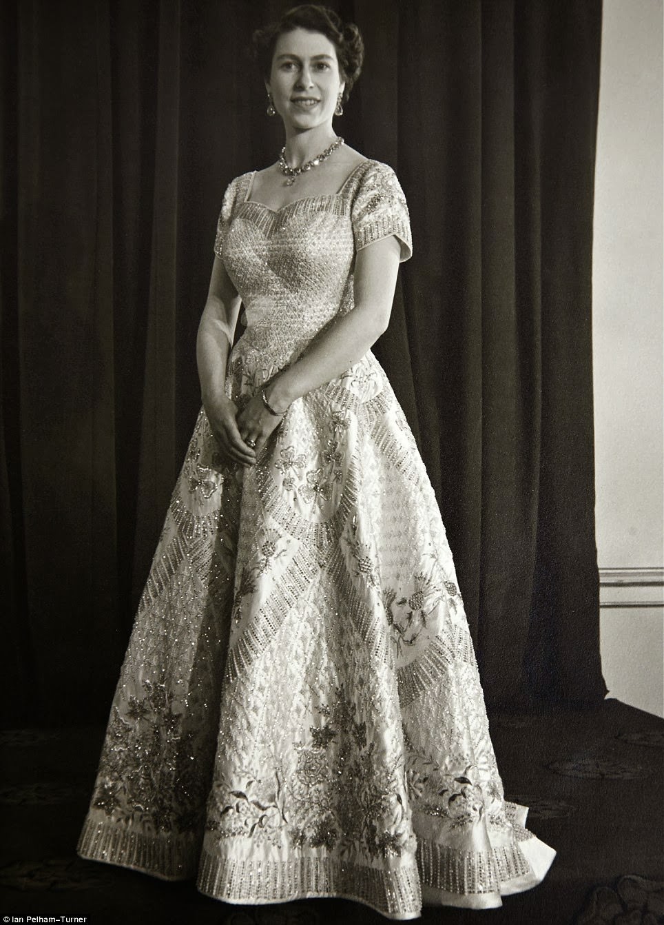 The Queen in her coronation gown that was designed by Sir Norman Hartnell.
