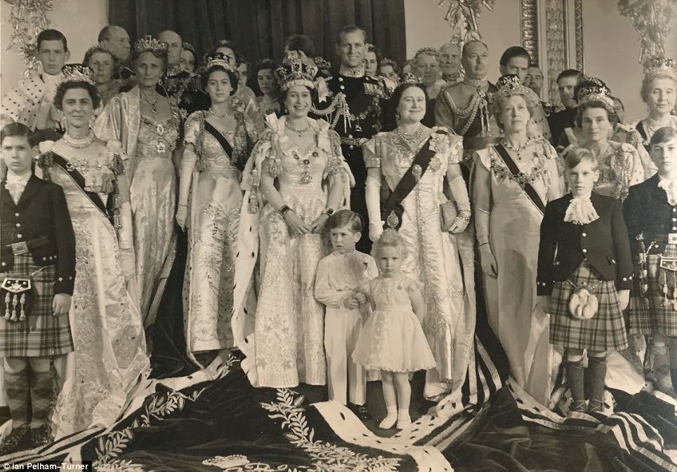 The Queen beams in the centre of this royal family portrait taken on the day of her coronation.