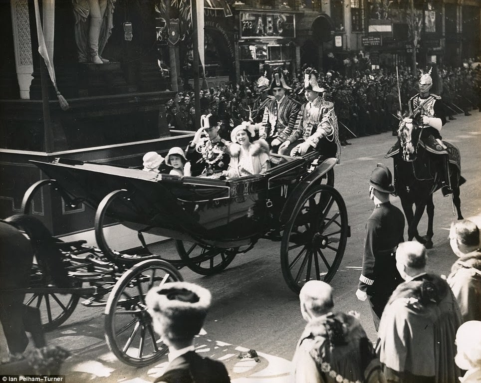 Here the Queen takes part in another silver jubilee earlier in her life, that of her grandfather King George V in 1935. She travels in a carriage with her parents and sister.