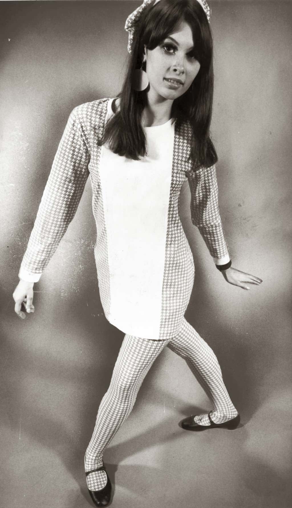 "Abstract houndstooth checks of stretch nylon are fashioned into tights with fencer-front tunic top plus cap ($20) at Cheetah boutique." — Ron Bailey, Chicago Tribune, Oct. 10, 1966