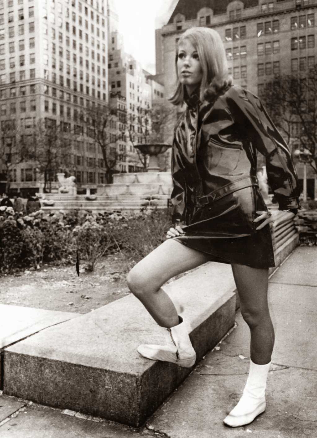 "Dressed in British designer Paul Blanche's "Raingear," a flared hipster miniskirt and Ike jacket, model Lorna McDonaugh brightens the scene at the plaza at 59th St. Such outfits could make rainy days popular." — UPI Telephoto, Nov. 9, 1966