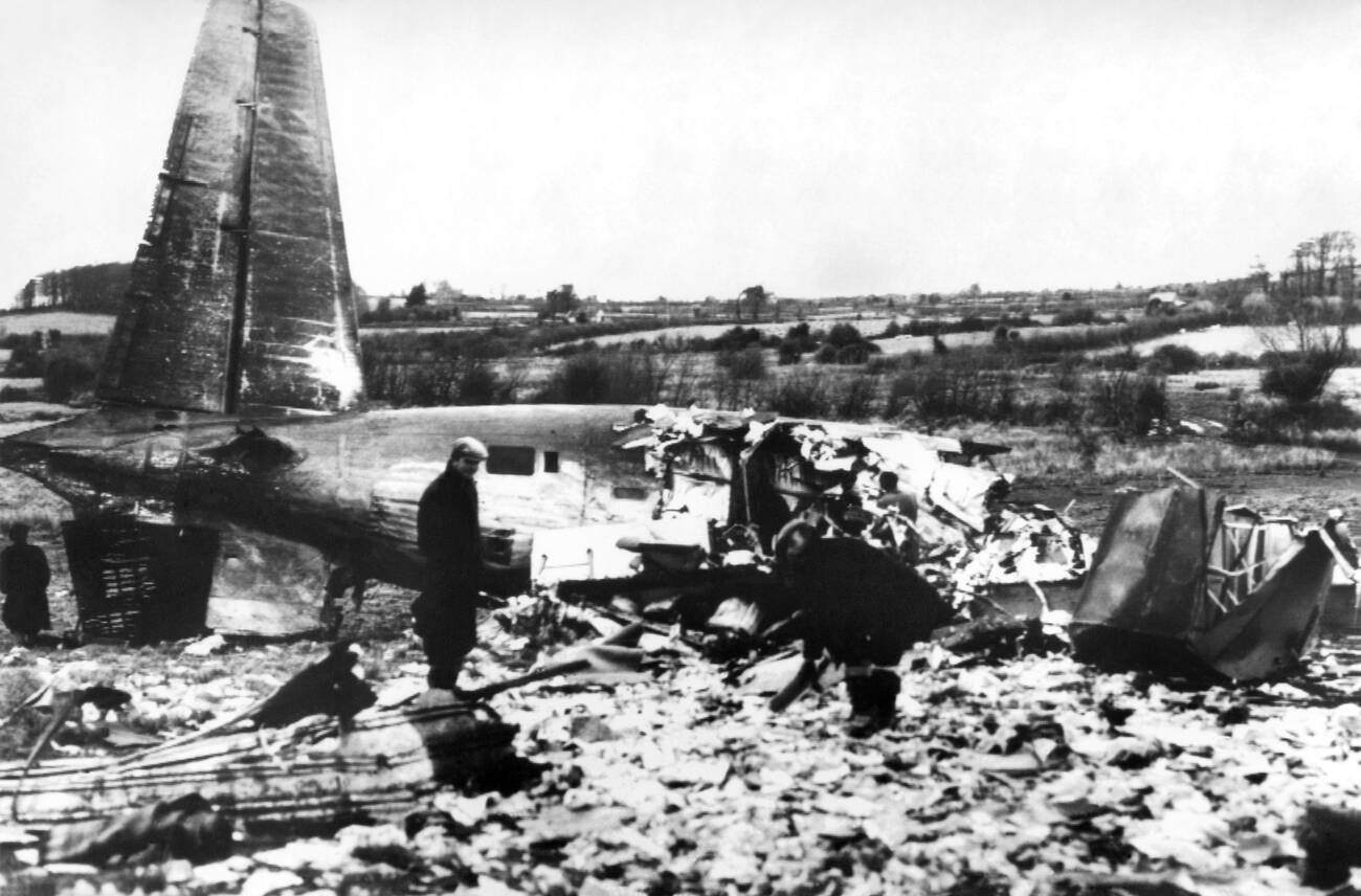 Twenty-six people were killed in an airliner crash near Shannon Airport; the wrecked tail-piece was the only part of the plane that did not disintegrate as workmen search for letters from the mail amongst thousands of papers, February 1960.