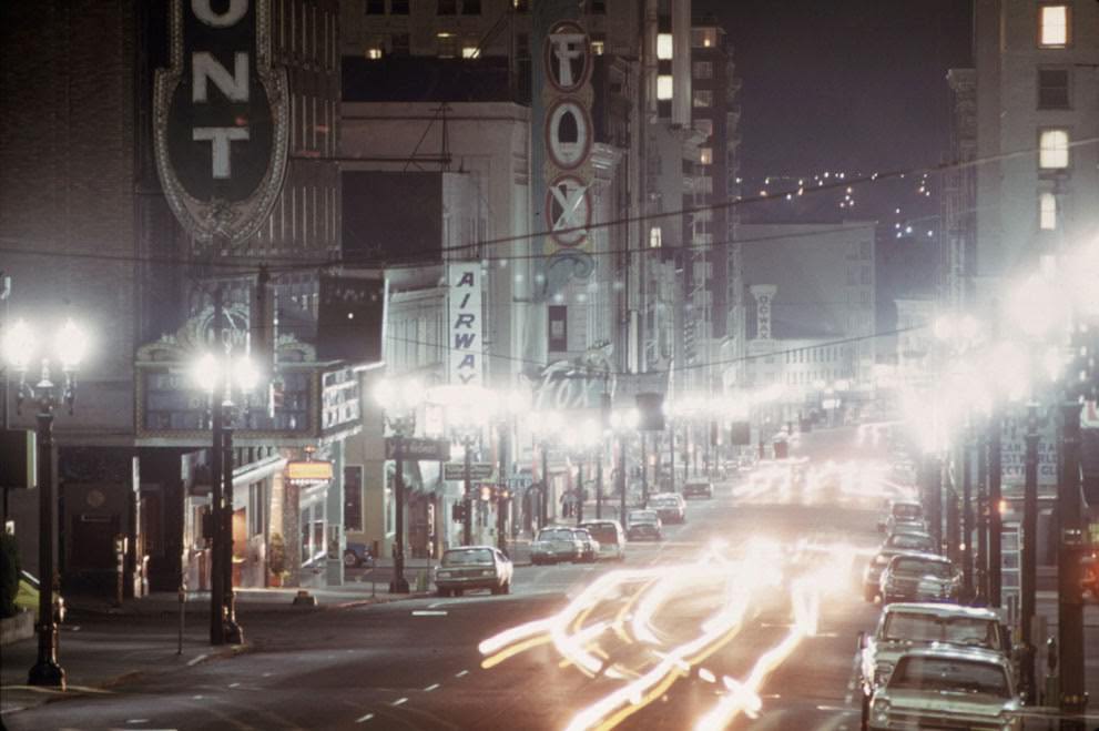 Looking down Southwest Broadway in Portland, Oregon, limited lighting during the energy crisis, 1973.