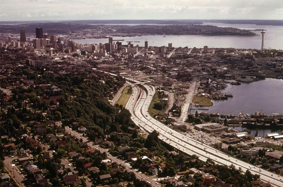 The city of Seattle and Interstate Highway 5, with Elliott Bay at right, 1973.