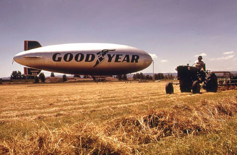 Threshing at Pearson Field, Vancouver, Washington, with the Goodyear Blimp in the background, 1973.