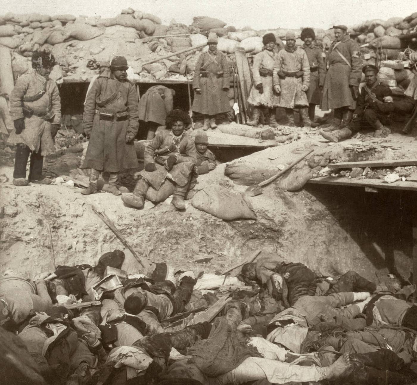 A trench filled with dead Japanese soldiers inside a Russian fort at Port Arthur, China, 1905.