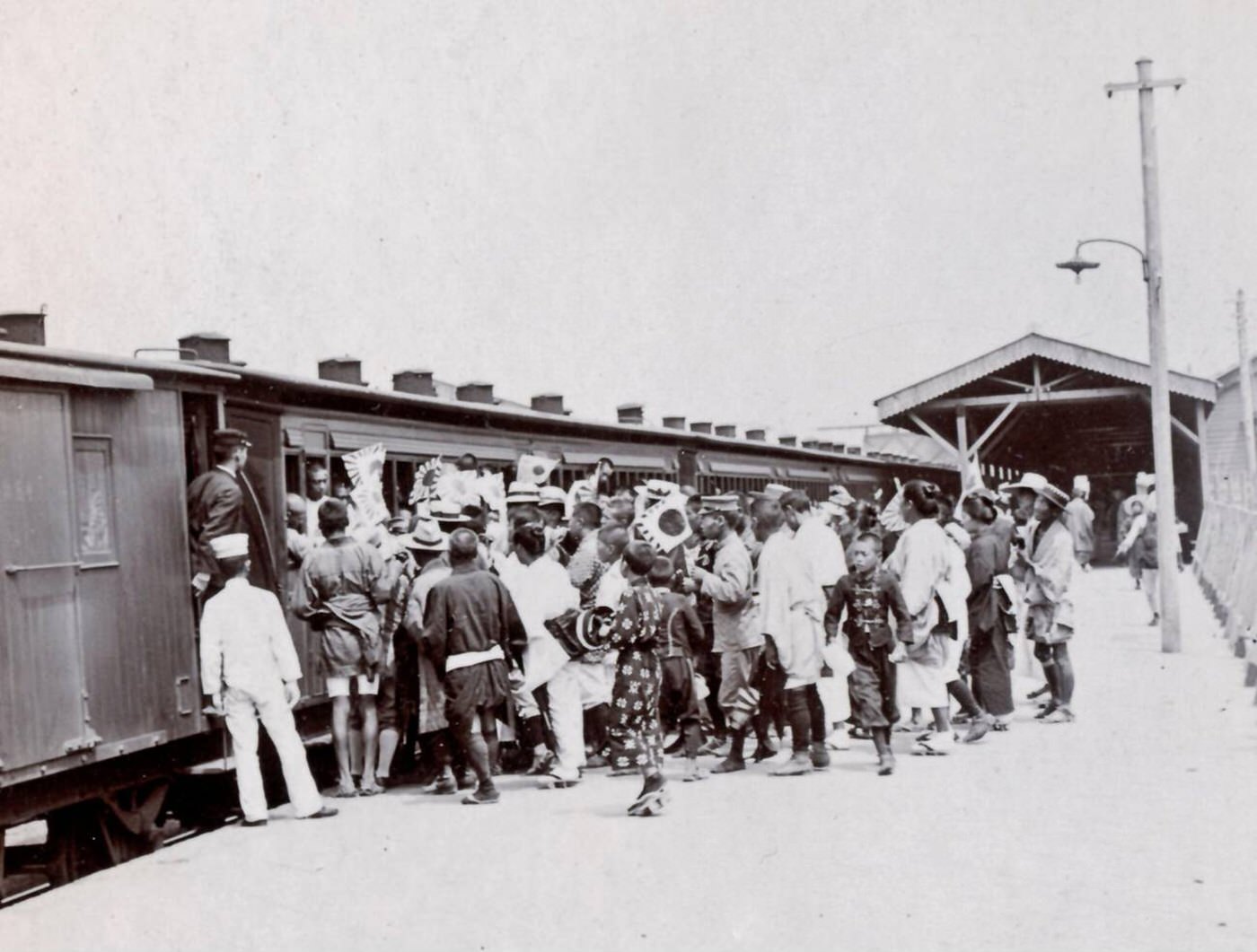 Parents and friends seeing off departing soldiers during the Russo-Japanese War, 1900s.