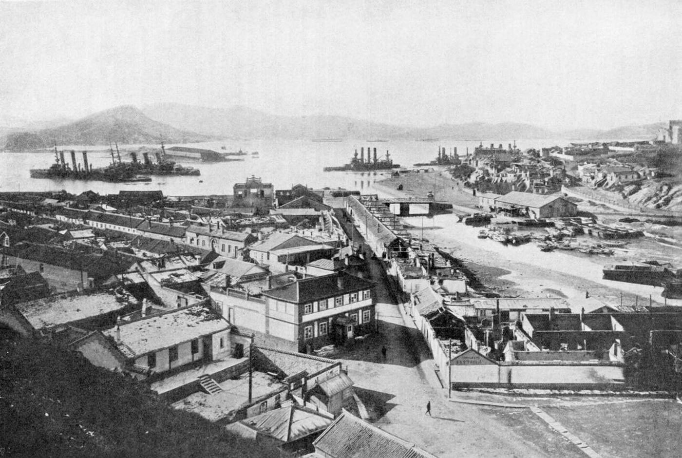 View of Port Arthur a few days before its fall, showing stranded Russian battleships, July, 1904.