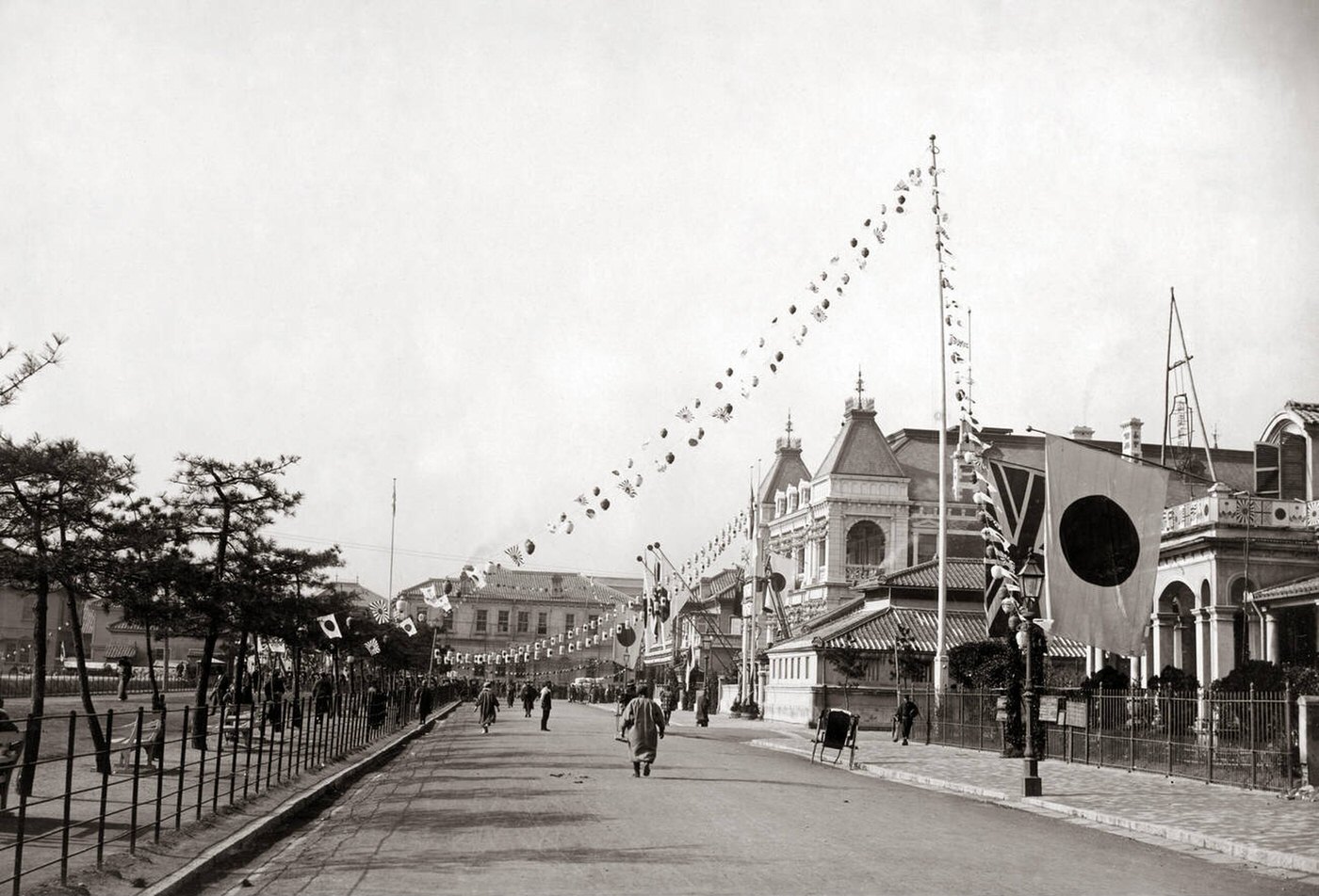 The Bund is decorated with flags to celebrate the fall of Port Arthur (Lushun) in the Russo-Japanese War.