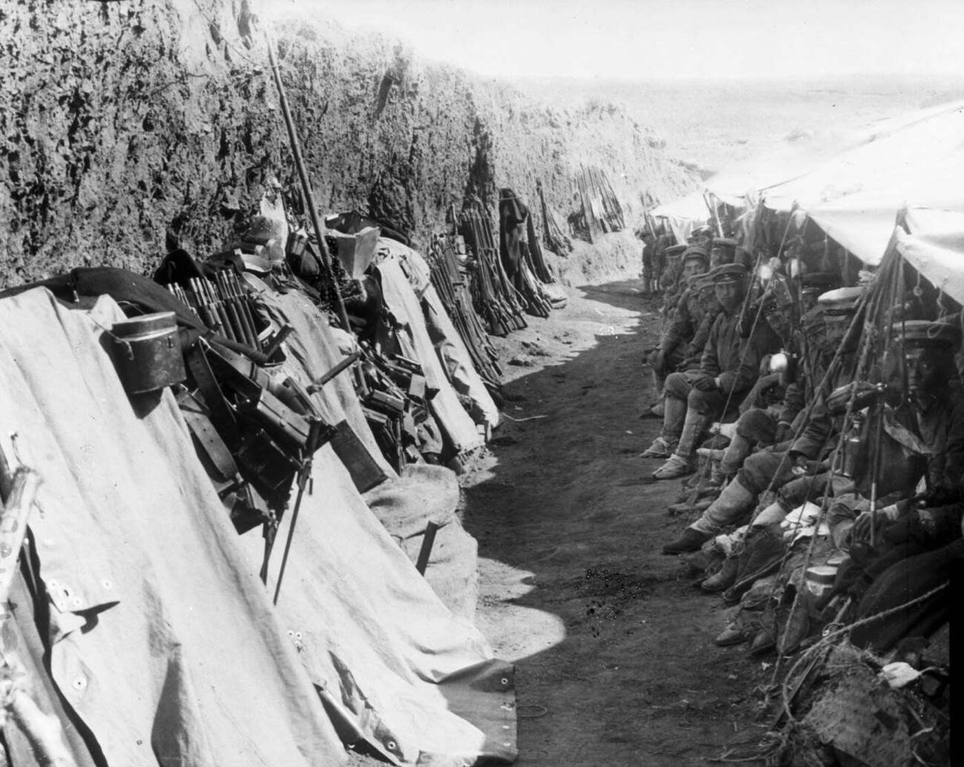 Japanese soldiers resting in a trench during the Russo-Japanese War, Port Arthur, China, 1905.