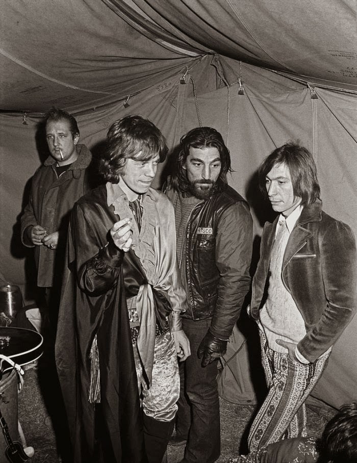 Mick Jagger & Charlie Watts with Hells Angel, Altamont, 1969.