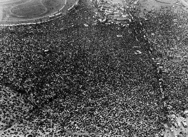 A crowd of rock fans gathered at Altamont Speedway for a rock concert by the Rolling Stones, 1969.
