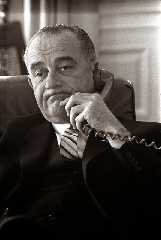 President Lyndon Johnson talks on the telephone from the Oval Office, 1964.
