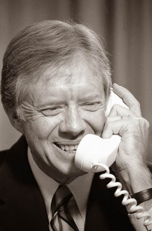 President Jimmy Carter thanks Canadian Prime Minister Joe Clark from the Oval Office of the White House, Washington, 1980.