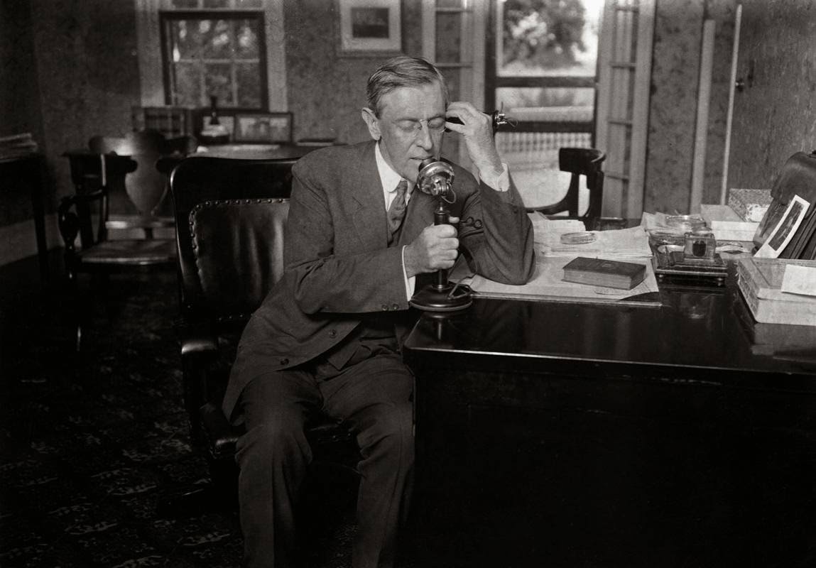 President Woodrow Wilson speaks on the telephone.