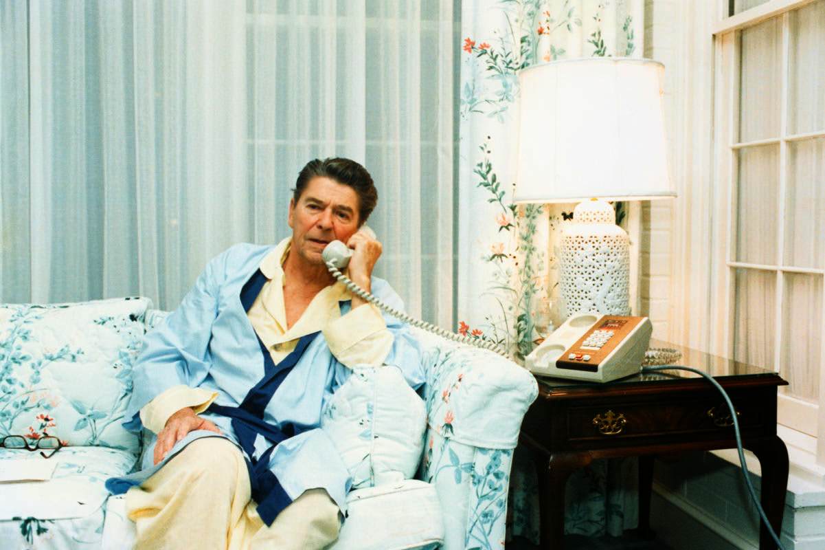 President Ronald Reagan telephones Vice President Bush regarding the Grenada situation from the White House, Washington, DC, 1983.