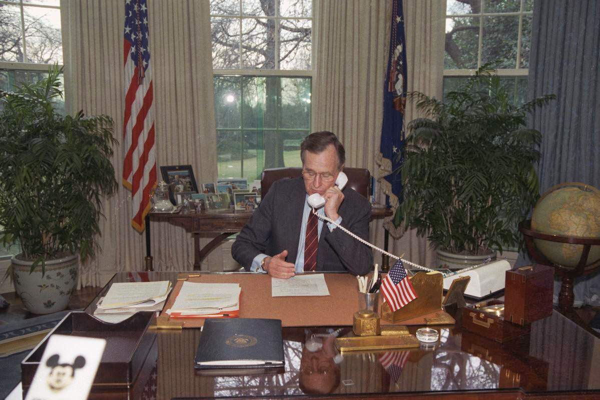 President George H. W. Bush addresses demonstrators gathered on the Ellipse behind the White House, 1990.
