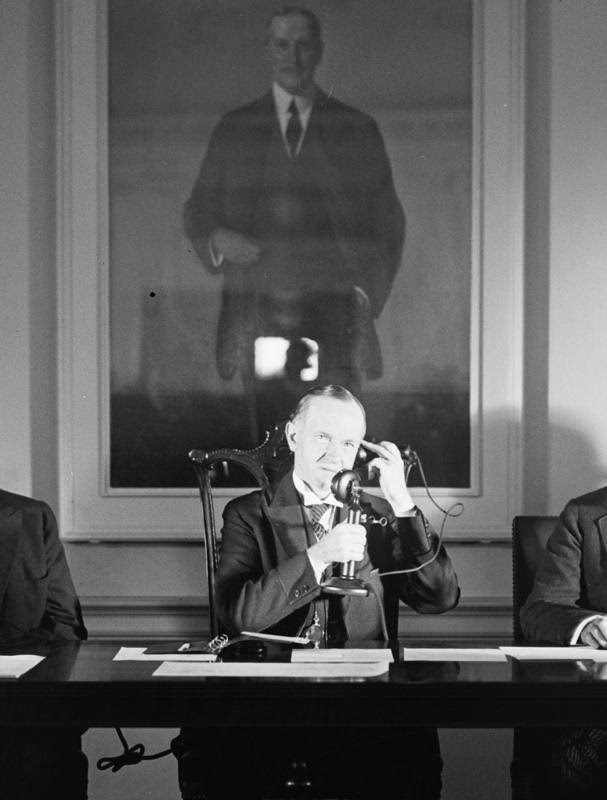 President Calvin Coolidge speaks on the telephone, 1928.