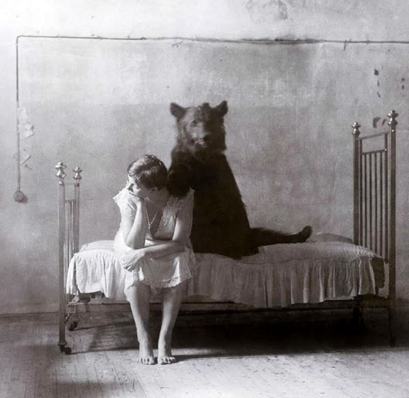 Bear and girl, circa 1912.