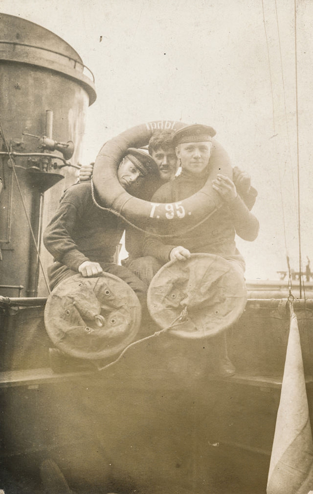 Three men cramming their heads into a life preserver.