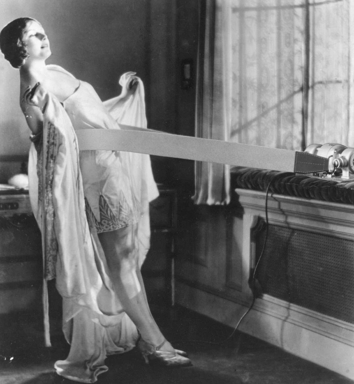 A woman enjoying the use of her Vibro-Slim vibrating slimming machine.
