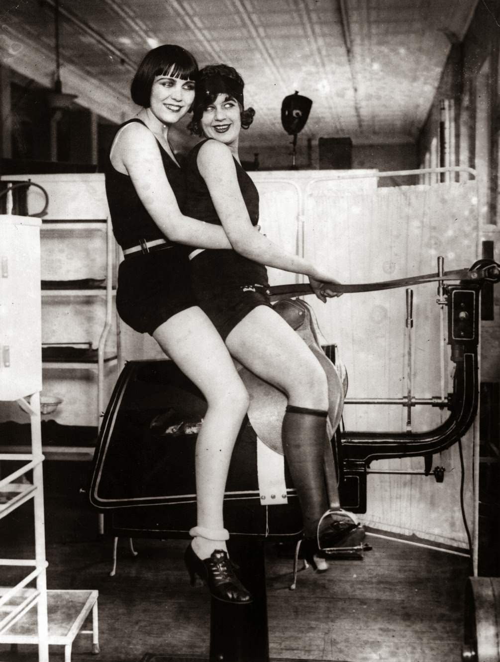 Two women riding a mechanical horse, ,1920s.