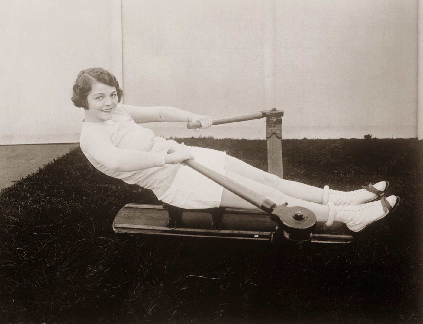 Helene Chadwick exercising on a rowing machine, circa 1925.
