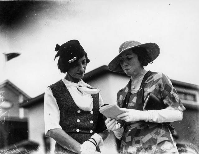 Two women picking a winner at the races, Brisbane, 1933