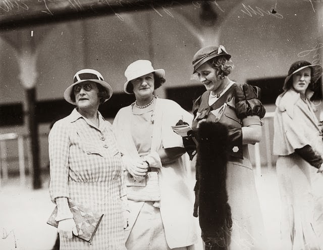 Checking the form guide at Ascot races, Brisbane, 1933
