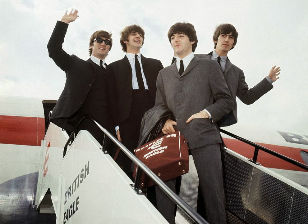 The Beatles leave London airport, 1964.