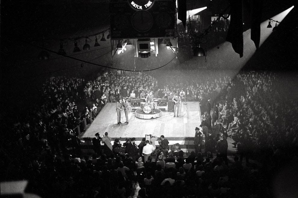 The Beatles perform at the Coliseum in Washington, D.C., during their first American tour, 1964.