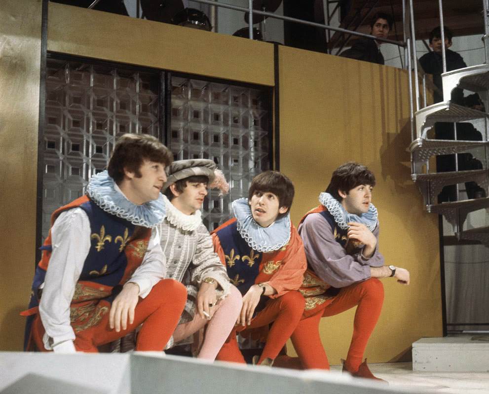 The Beatles rehearse for their forthcoming television show at Wembley studios in London; Ringo Starr is costumed as Sir Francis Drake, and John Lennon, George Harrison and Paul McCartney play Heralds, 1964.