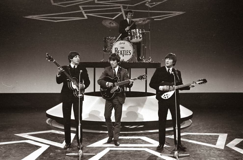 The Beatles during television recordings in Hillegom, Netherlands; drummer Ringo Starr was briefly hospitalized after a tonsillectomy, and Jimmie Nicol sat in on drums for several concerts, 1964.