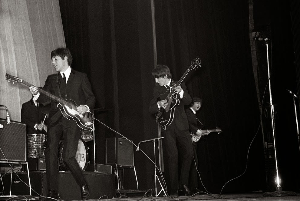 The Beatles perform their first concert outside of Britain, at the Olympia in Paris, 1964.