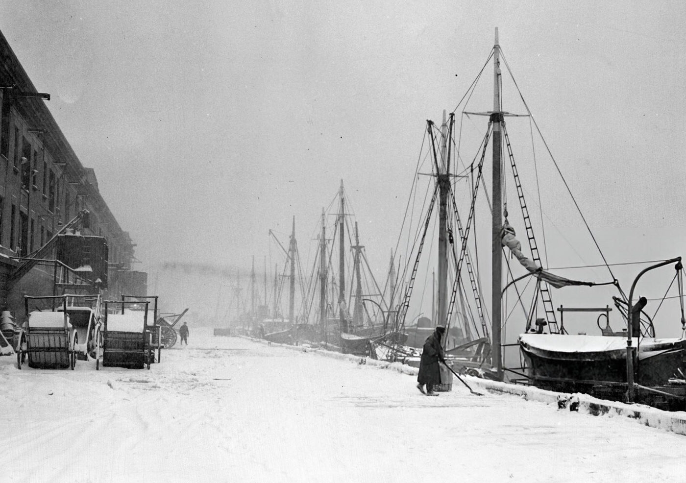 A man shovels snow off Fish Pier in Boston, 1947.