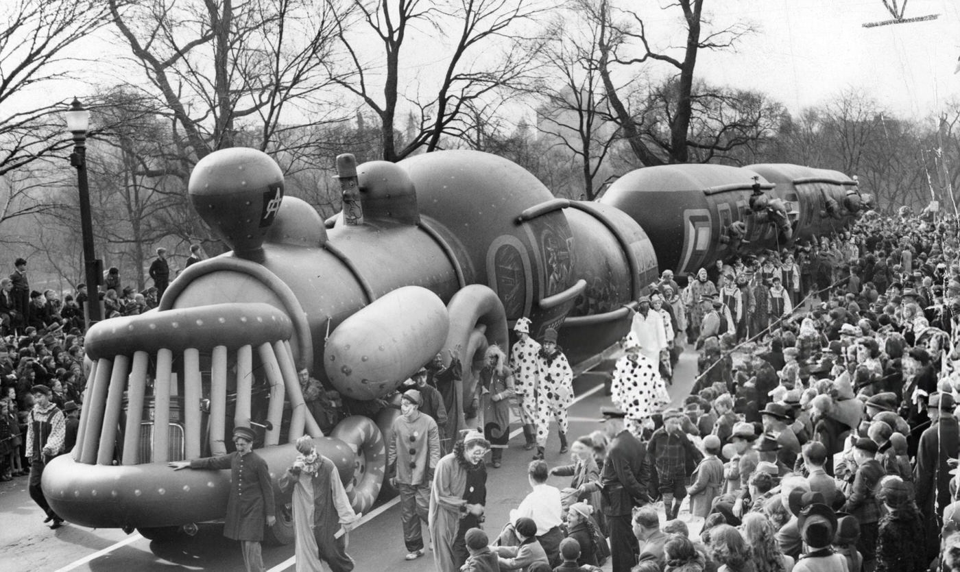 The train balloon is led along Beacon Street during the annual Santason parade in Boston, 1941.