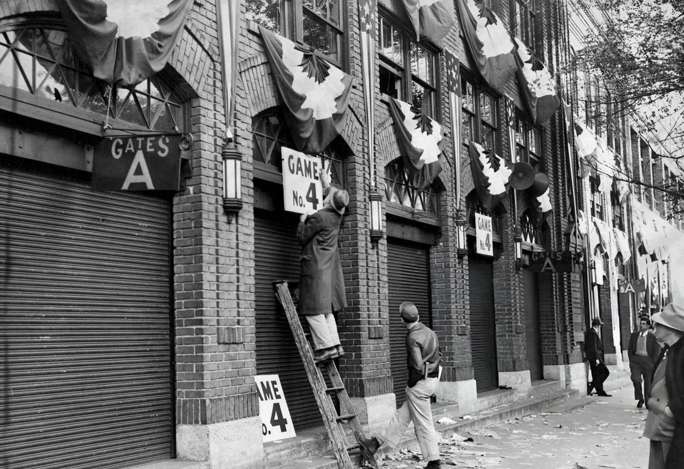 Men put up signs for Game Four of the World Series outside Fenway Park in Boston, 1946.